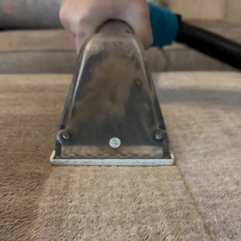 chair cleaning tool removing dirt from upholstery